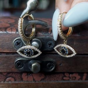Evil eye huggie earrings
